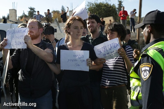 Walking with signs (Photo: Activestills). 