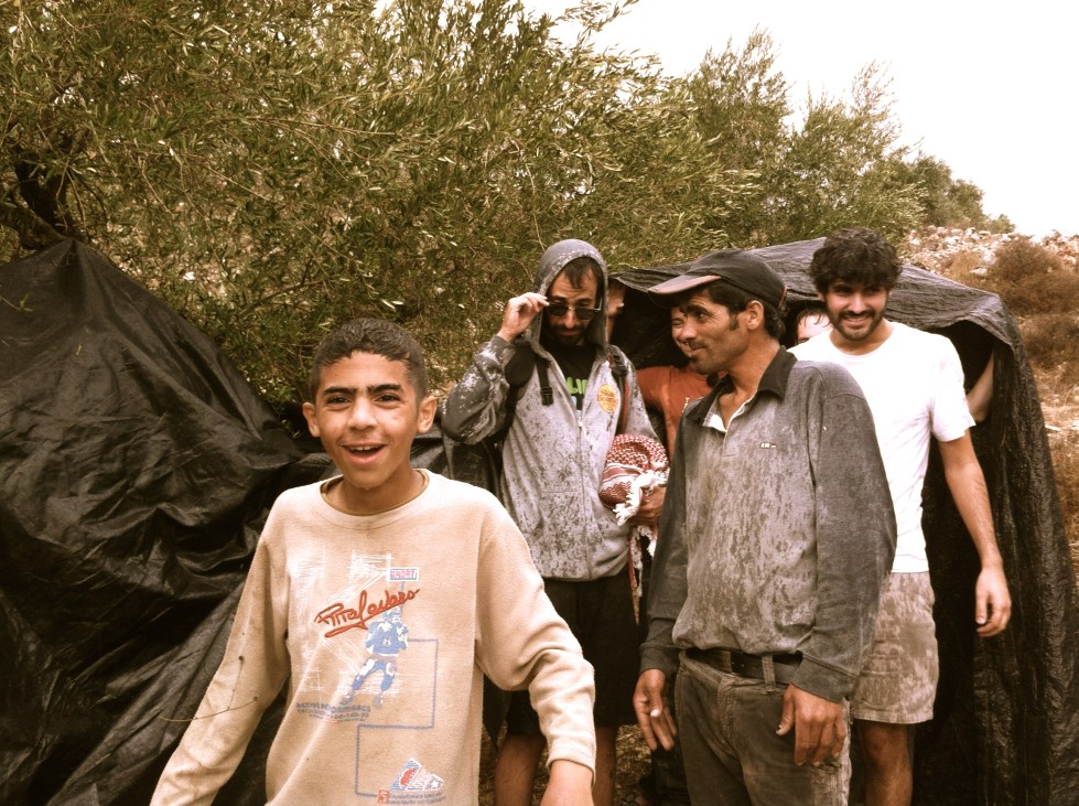 Palestinian farmers and Israeli volunteers stuck in the Fall near the village of Burin   