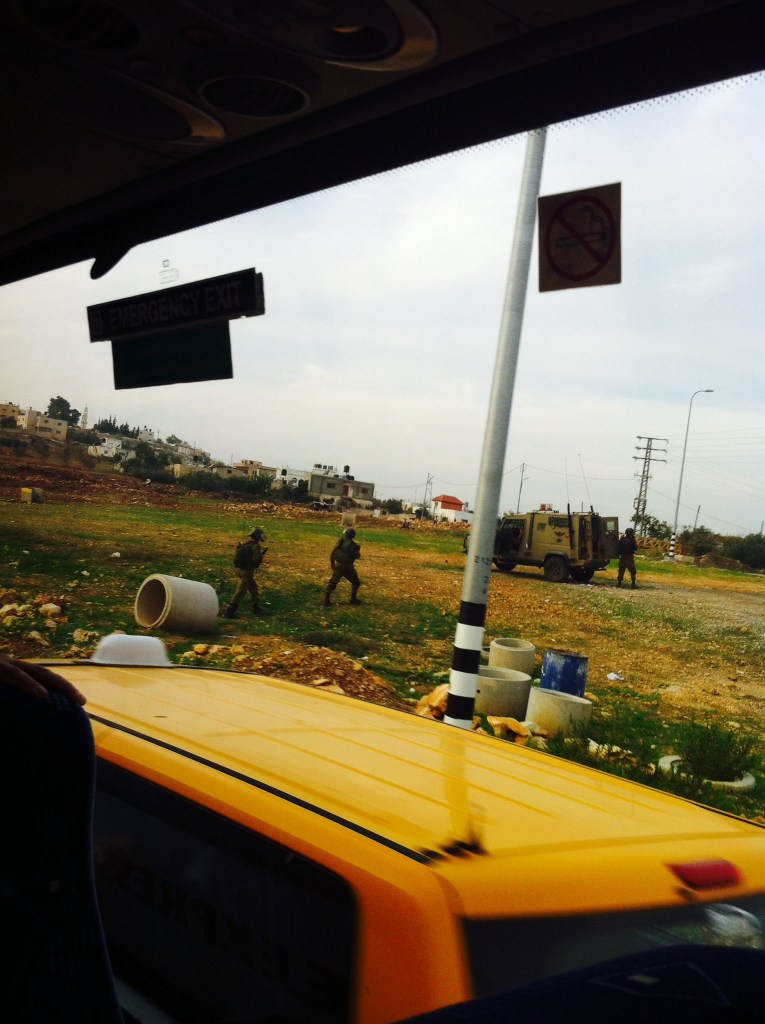 This photo is not from Ofer, where cameras are not allowed, but rather from later in the day, when we passed by a clashes between Israeli soldiers and stone throwing Palestinian youths near the village of Nabi Saleh