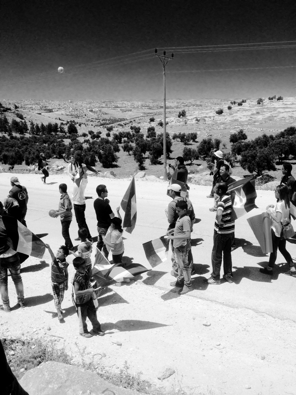 But the marchers, having accomplished what they'd set out to do -- declare their presence, and their intention to stay in their village -- dispersed, and no one was sprayed. 